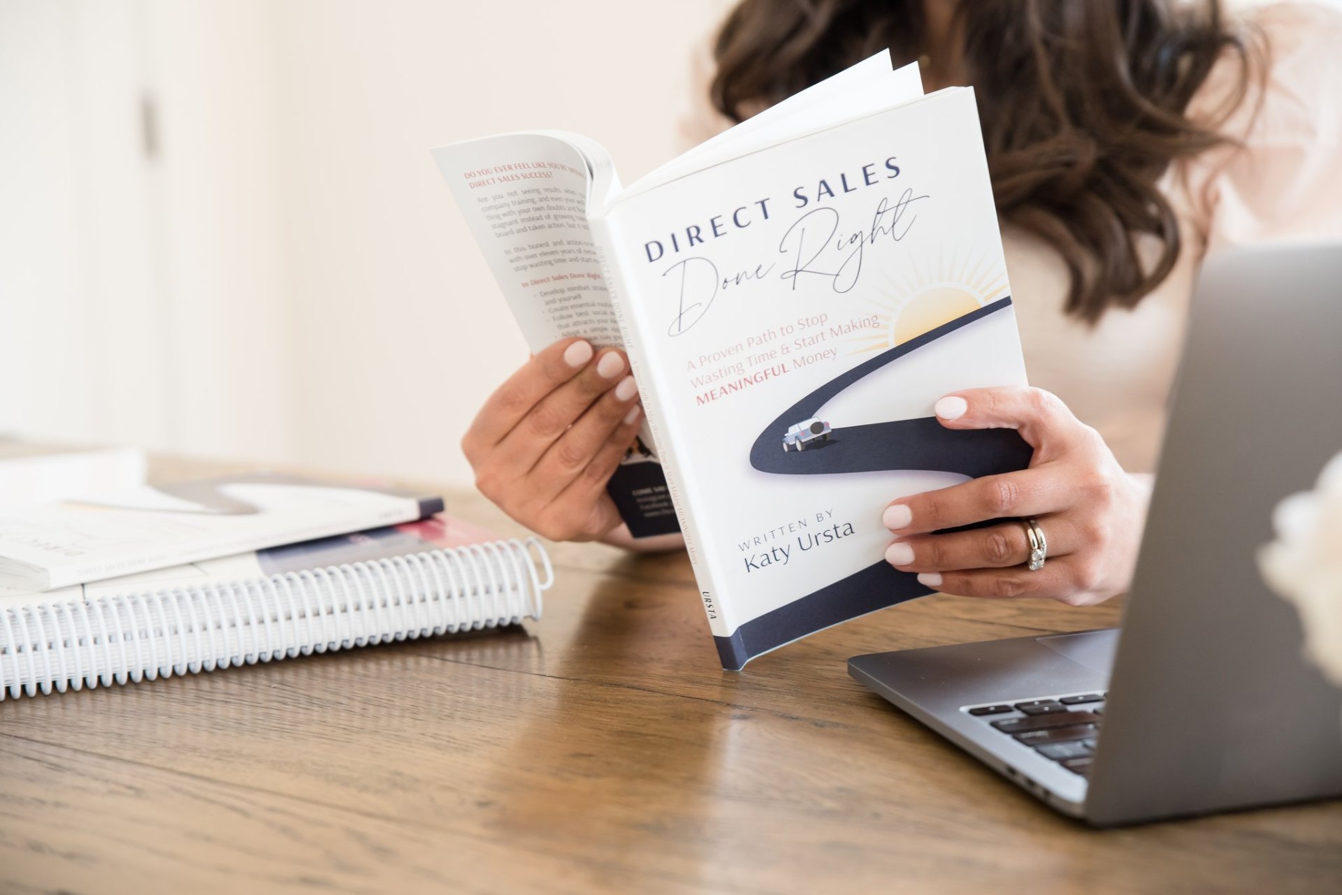 Katy Ursta reading Direct Sales Done Right book